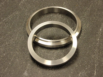 Marmon adapter ring rolled forgings, precision machined.